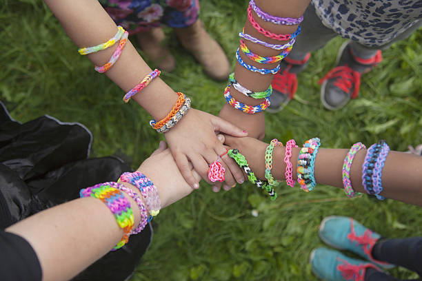 Kids showing off their DIY bead bracelets