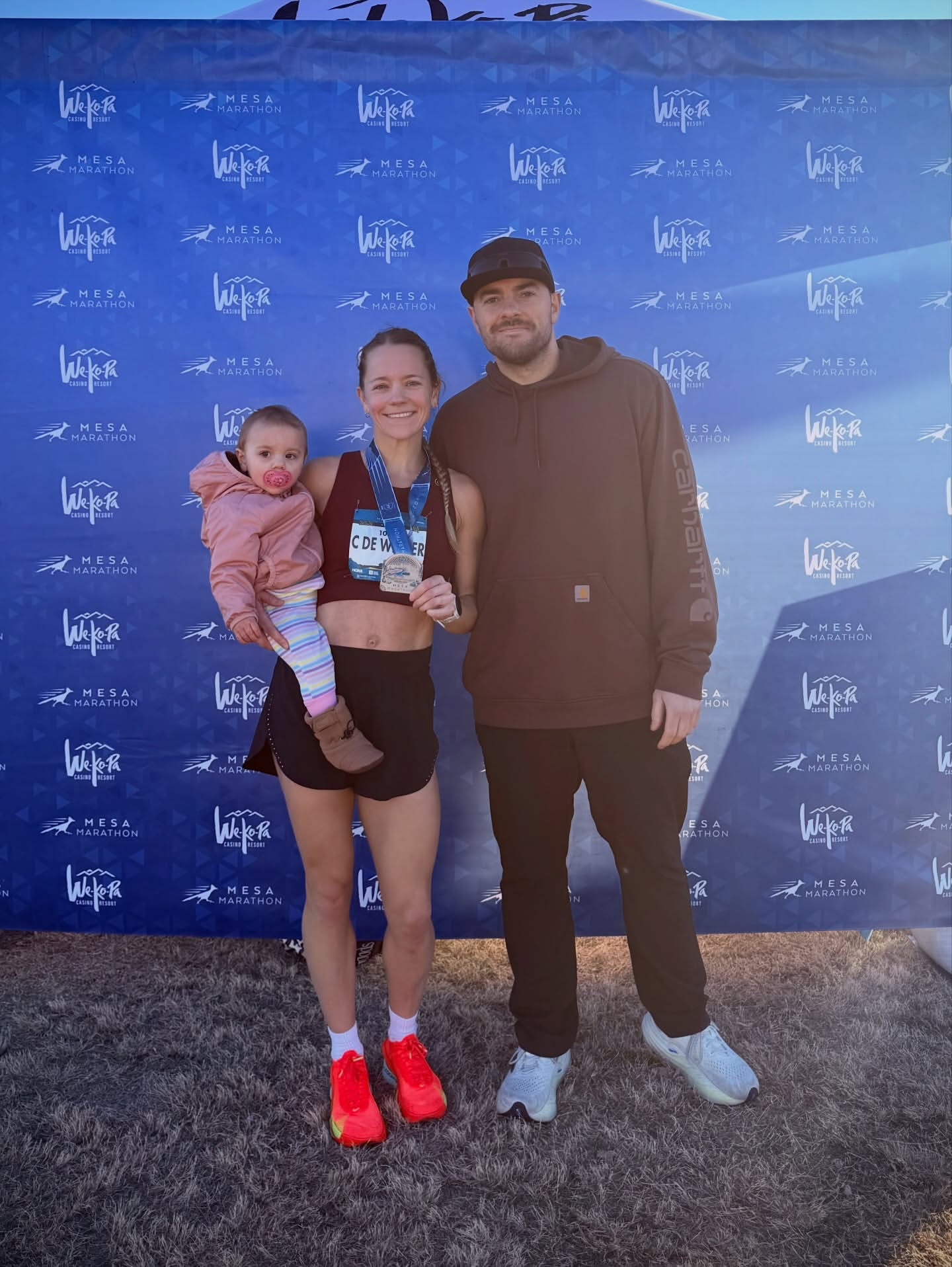 Cassandra with her family at the Mesa Marathon