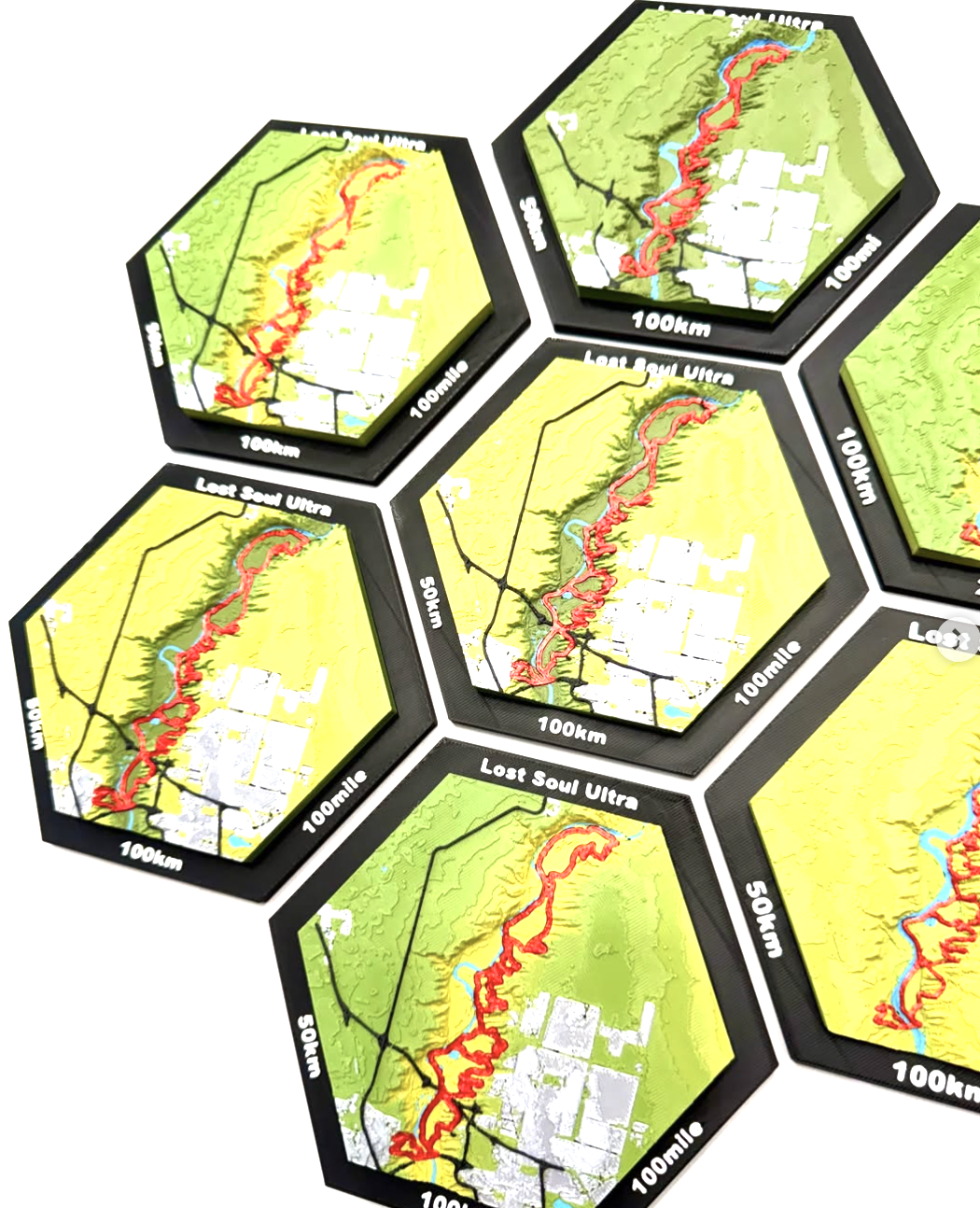 Collection of Mile-Mark Customs 3D-printed hexagonal race course plaques
